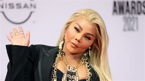 Trendsetter!: Lil' Kim Rocks The Prada Logo In Her Bangs To 